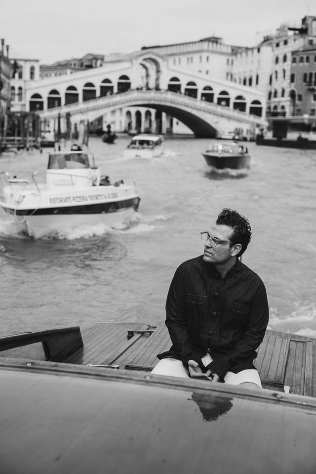 Monochrome travel portrait beside a canal